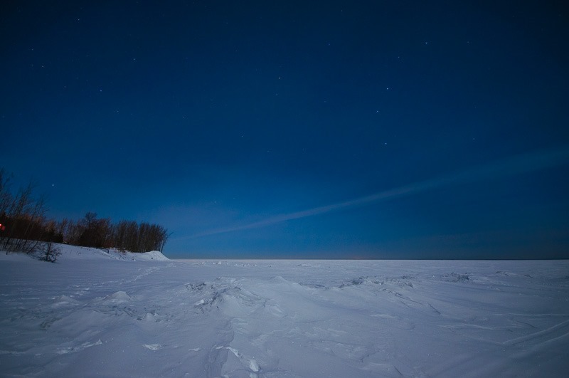 A bright moon shining over Lake Winnipeg